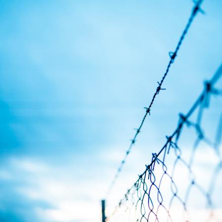 barbed wire fence social barrier